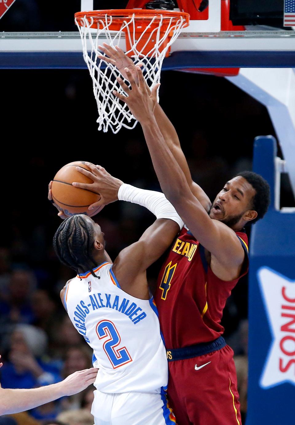 Cavaliers forward Evan Mobley (4) defends against Oklahoma City Thunder guard Shai Gilgeous-Alexander during a recent game. Teammate Kevin Love said he can see Mobley developing into a Defensive Player of the Year in the NBA.