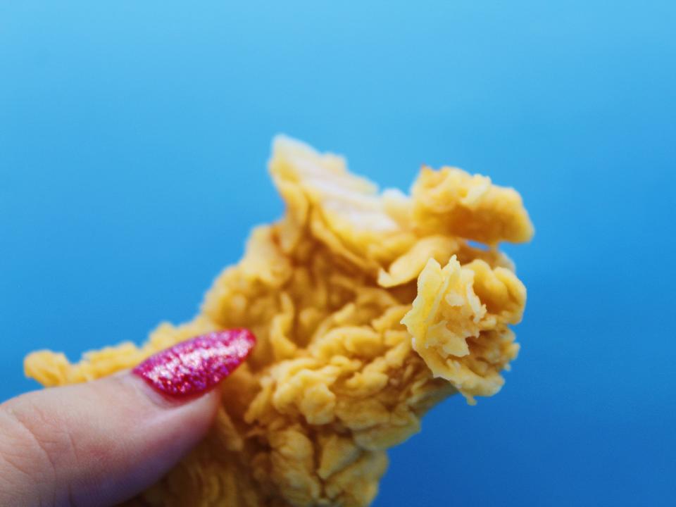 popeyes chicken tender on blue background