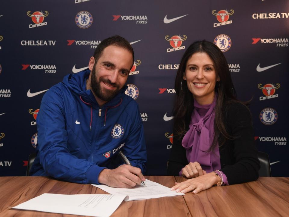 Gonzalo Higuain, pictured signing his Chelsea contract with club director Marina Granovskaia, will try to solve the Blues’ inconsistency at striker. (Getty/Chelsea Football Club)