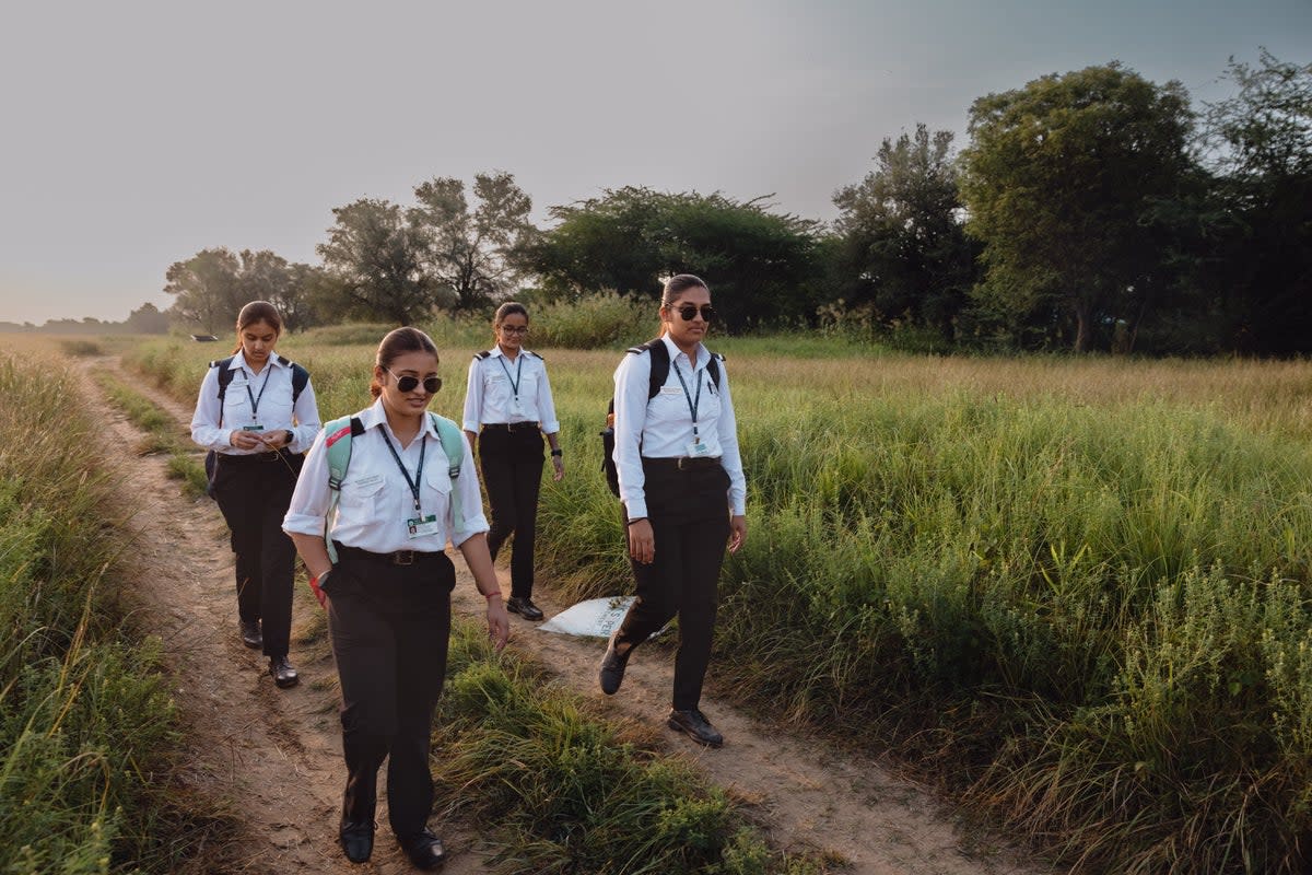 Pilot students walk to campus at Banasthali University in Jaipur on 15 September  (Getty Images)