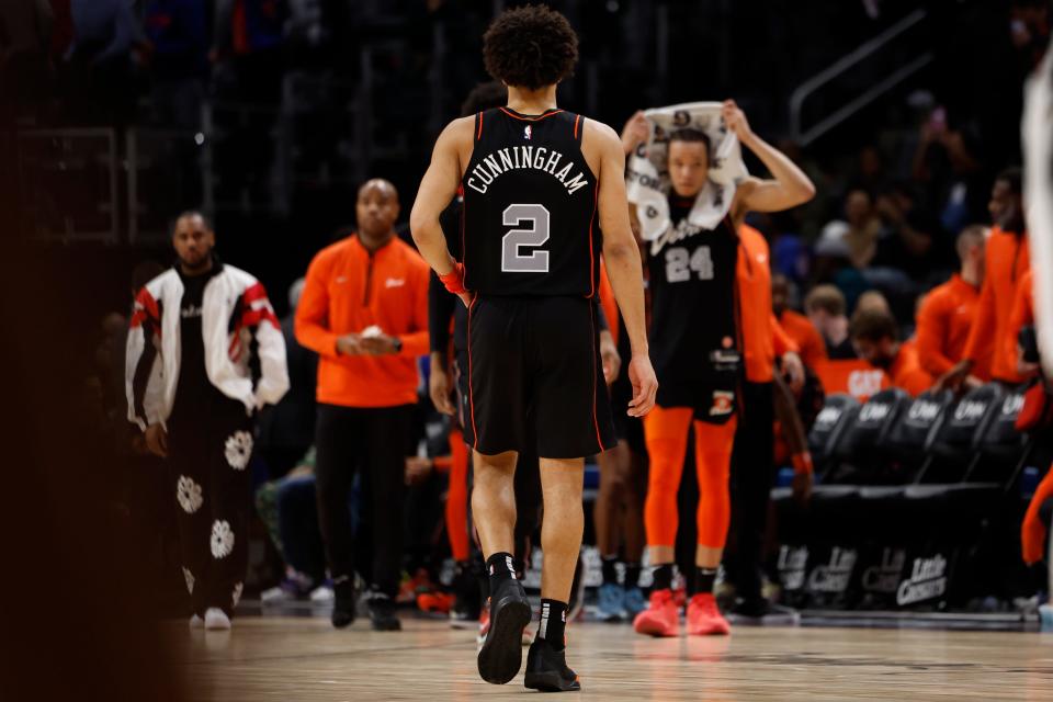 Pistons guard Cade Cunningham walks back to the bench after the 118-112 loss to the Nets on Dec. 26, 2023, at Little Caesars Arena. The Pistons set the NBA in-season record with their 27th straight loss. They would lose once more before mercifully winning.