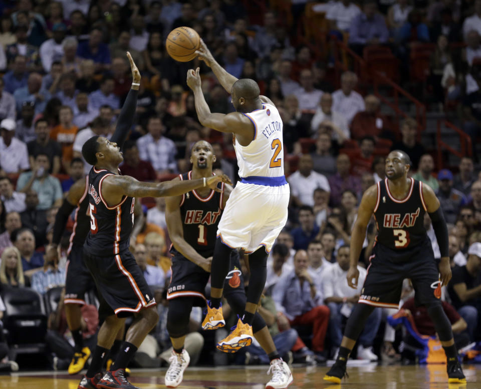 New York Knicks point guard Raymond Felton (2) passes against the Miami Heat during the first half of an NBA basketball game in Miami, Thursday, Feb. 27, 2014. (AP Photo/Alan Diaz)