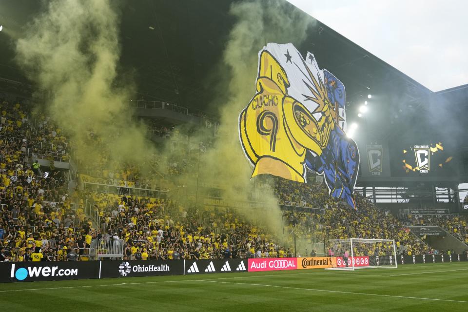 Fans in the Nordecke raise a tifo prior to the MLS soccer match between the Columbus Crew and FC Cincinnati at Lower.com Field in August. The two sides face again on Saturday for the right to host MLS Cup.