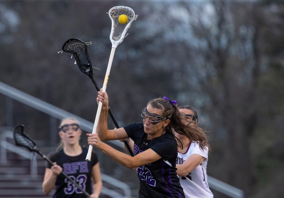 Rumson-Fair Haven Eliott Van Nice (No. 22) takes a shot. Rumson-Fair Haven Girls Lacrosse vs Red Bank Regional in Little Silver, NJ on April 13, 2022.