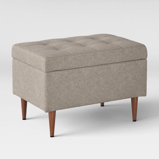 <a href="https://www.target.com/p/lemoor-mid-century-ottoman-with-storage-project-62-153/-/A-52385042#lnk=newtab" target="_blank">Shop it here</a>.&nbsp;