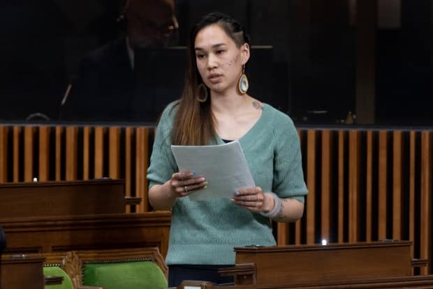 NDP MP Mumilaaq Qaqqaq rises in the House of Commons, in Ottawa, on May 13. 'I feel — and I'm going to try not to cry during this — but I feel extremely isolated,' she said in an interview with CBC. (Adrian Wyld/The Canadian Press - image credit)