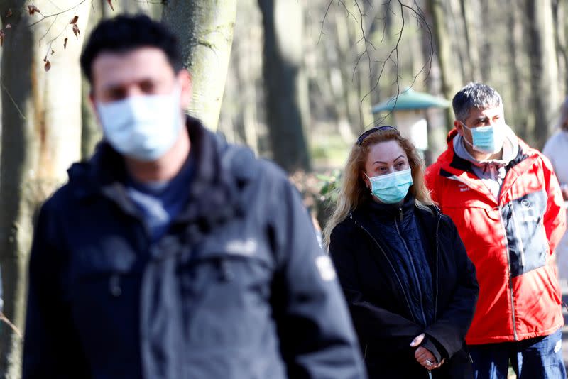 People queue outside a test centre for coronavirus disease (COVID-19) at Havelhoehe community hospital in Berlin