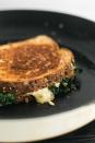 A grilled cheese sandwich fit for an adult loaded with wilted kale and perfectly melted gouda cheese. <a href="https://www.epicurious.com/recipes/food/views/garlicky-kale-grilled-cheese-with-melted-gouda?mbid=synd_yahoo_rss" rel="nofollow noopener" target="_blank" data-ylk="slk:See recipe.;elm:context_link;itc:0;sec:content-canvas" class="link ">See recipe.</a>