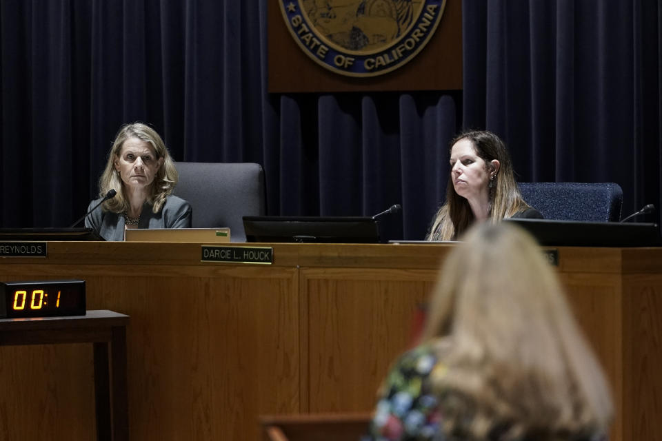 California Public Utilities Commission president Alice Reynolds, left, listens to public comment during a meeting regarding a proposed robotaxi expansion Thursday, Aug. 10, 2023, in San Francisco. (AP Photo/Godofredo A. Vásquez)