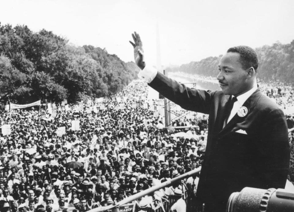 Martin Luther King waving during his &quot;I have a dream&quot; speech