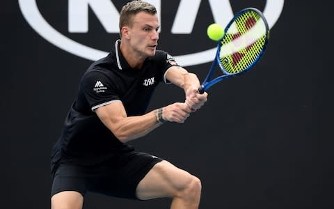 Marton Fucsovics of Hungary plays a backhand during his Men's Singles third round match against Tommy Paul of the United States