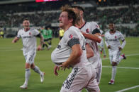 St Louis City FC Tim Parker (26) holds the ball under his jersey as he celebrates his goal against the Austin FC during the first half of an MLS soccer match in Austin, Texas, Saturday, Feb. 25, 2023. (AP Photo/Eric Gay)