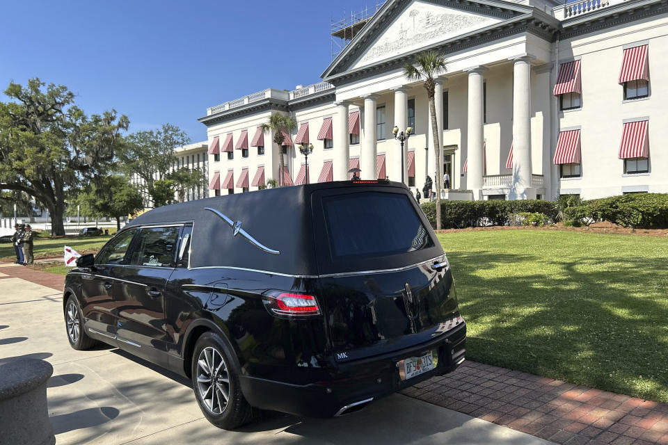 A hearse carrying former U.S. Sen. Bob Graham’s casket sits outside the Old Capitol building in Tallahassee, Fla., Friday, April 26, 2024. Graham, a Democrat who also served as Florida governor, died April 16. (AP Photo/Brendan Farrington)