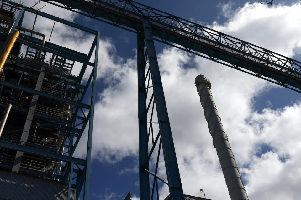 The AES Corporation's coal-fired power plant is shown in Kapolei, Hawaii during a ceremony to mark the closure of the facility, Thursday, Aug. 18, 2022. As Hawaii transitions toward its goal of achieving 100% renewable energy by 2045, the state's last coal-fired power plant closed this week ahead of a state law that bans the use of coal as a source of electricity beginning in 2023. (AP Photo/Caleb Jones)