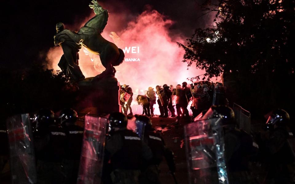 Police and protesters clash at Serbia's parliament on Friday as the Balkans face up to a renewed surge in coronavirus -  ANDREJ ISAKOVIC/AFP