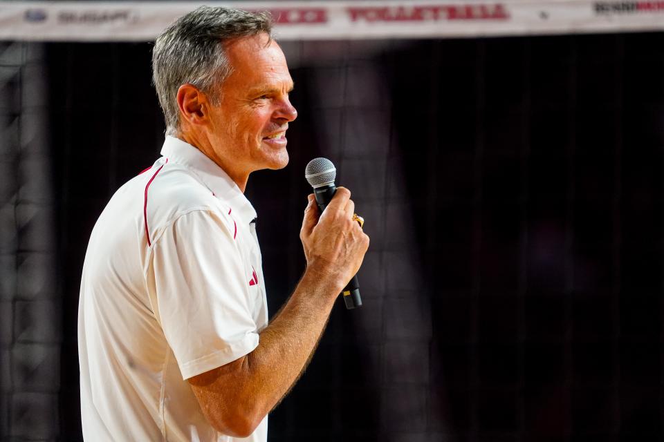 Nebraska head coach John Cook speaks to the crowd after the Cornhuskers' win over Omaha at Memorial Stadium.