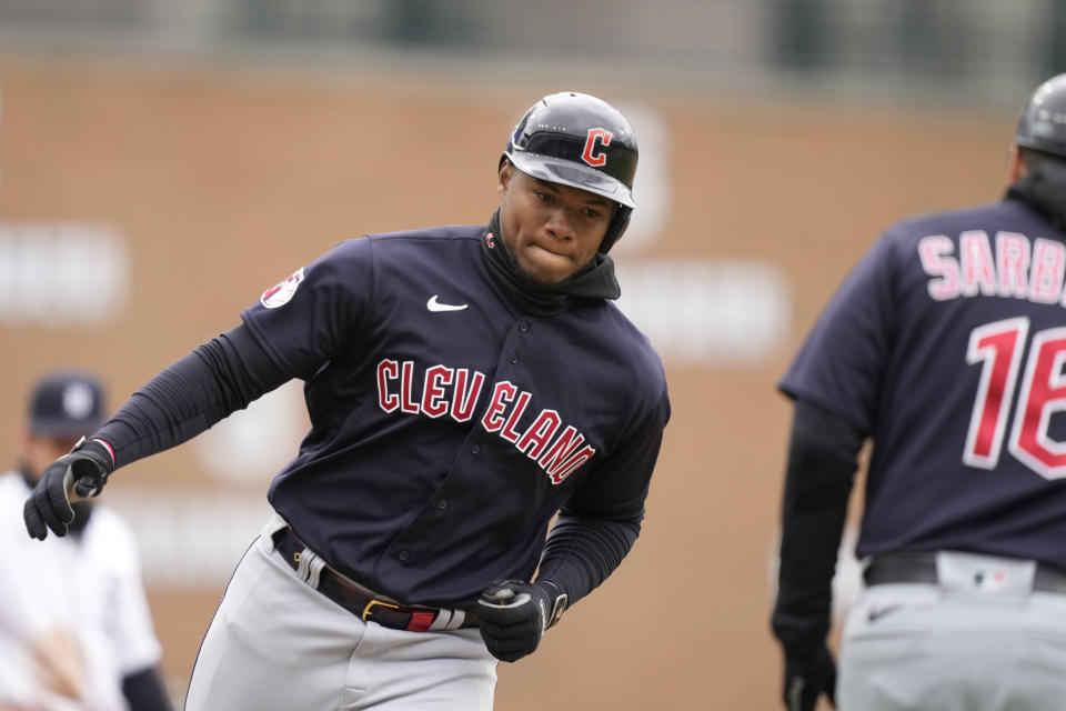 Cleveland Guardians right fielder Oscar Gonzalez third base after his two-run home run during the fourth inning in the first game of a baseball doubleheader against the Detroit Tigers, Tuesday, April 18, 2023, in Detroit. (AP Photo/Carlos Osorio)