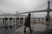 A man walks alone on the promenade under the FDR drive in Lower Manhattan, March 29, 2020. (AP Photo/Mary Altaffer)