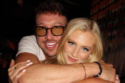 Samantha Feher and Kory Keefer hugging while at Sake No Hana in New York City.