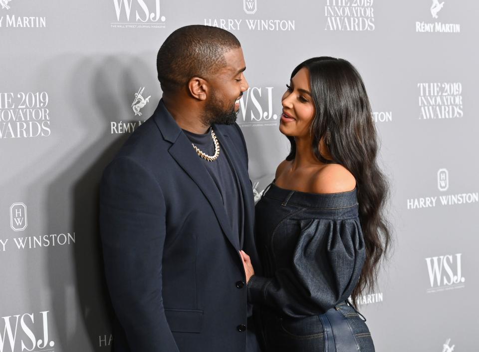 Kim Kardashian West (R) and husband US rapper Kanye West