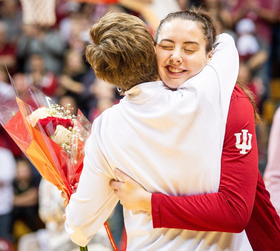 Indiana's Mackenzie Holmes (54) hugs Head Coach Teri Moren before the Indiana versus Maryland women's basketball game at Simon Skjodt Assembly Hall on Sunday, March 3, 2024.