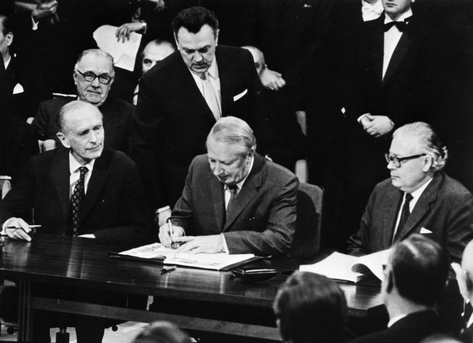 FILE - In this Jan. 22, 1972 file photo, British Prime Minister Edward Heath, center, signs the treaty for Britain to join the European Economic Community at the Palais d'Egmont in Brussels, Belgium. Following the Brexit vote in 2016, Britain's membership of what became known as the European Union, is scheduled to end on Jan. 31, 2020. (AP Photo, File)