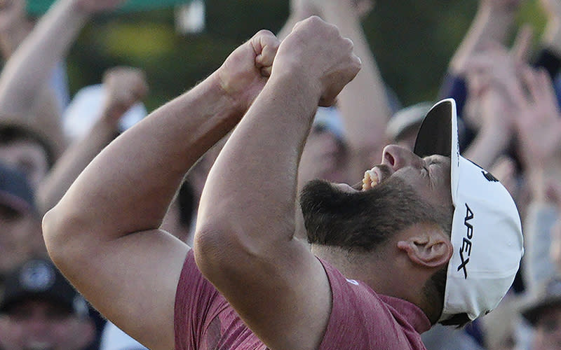 Jon Rahm shouts at the sky in celebration after winning the 87th Masters tournament at Augusta National Golf Club