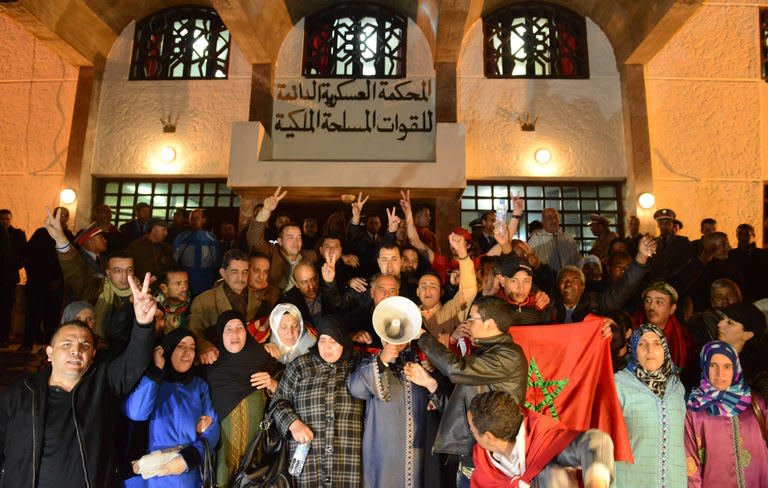 Families of the Moroccan security forces killed in 2010 by a group of Sahrawis, gather outside the court in Rabat on February 17, 2013. The Western Sahara issue is a highly sensitive subject in Morocco, which annexed the former Spanish colony in 1975 in a move not recognised by the international community. The the Sahrawi people in the area have demanded a referendum on self-determination