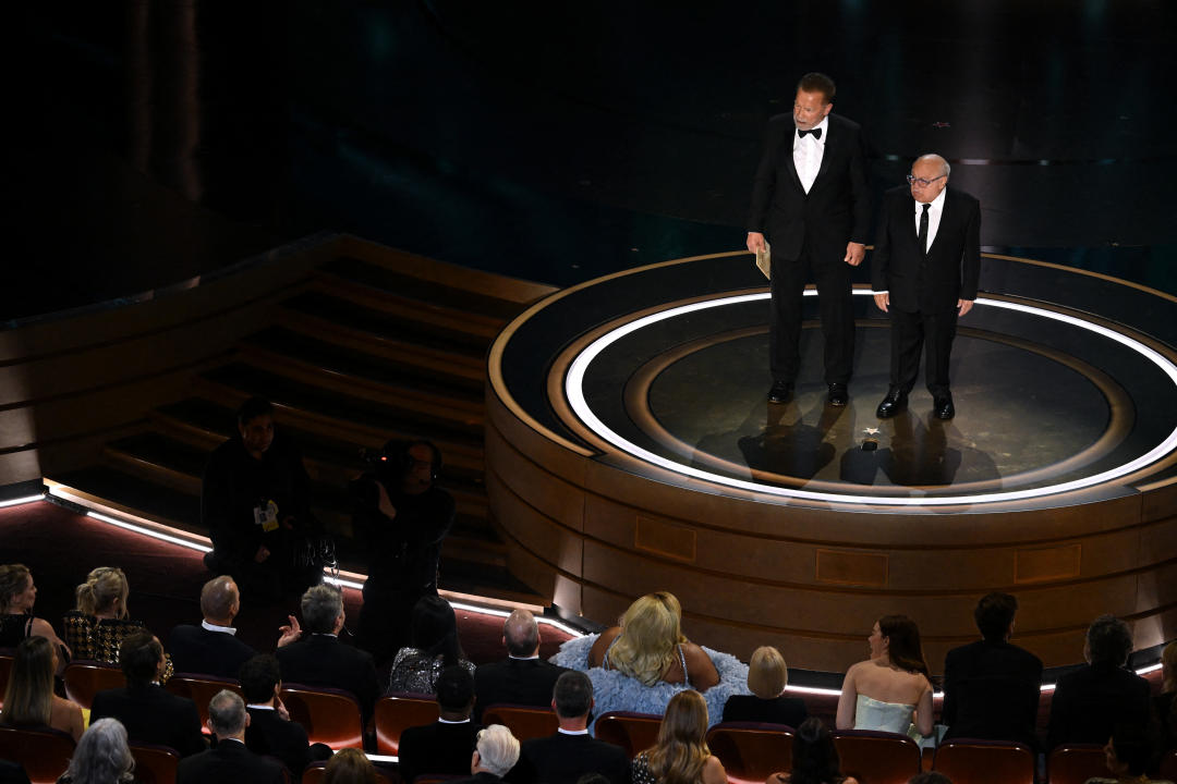 US actor Danny DeVito (R) and Austrian-US actor and former Governor of California Arnold Schwarzenegger present the award for Best Visual Effects onstage during the 96th Annual Academy Awards at the Dolby Theatre in Hollywood, California on March 10, 2024. (Photo by Patrick T. Fallon / AFP) (Photo by PATRICK T. FALLON/AFP via Getty Images)