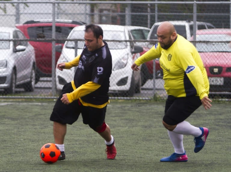 Two players vie for the ball during a soccer match as part of a program in Monterrey, Mexico that helps people lose weight