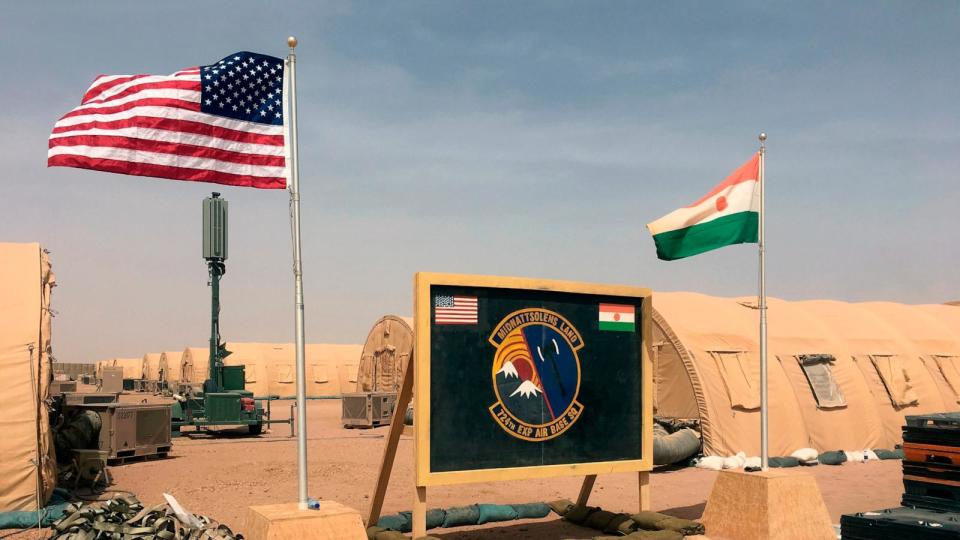 PHOTO: In this April 16, 2018 file photo a U.S. and Niger flag are raised side by side at the base camp for air forces and other personnel supporting the construction of Niger Air Base 201 in Agadez, Niger. (Carley Petesch/AP, FILE)
