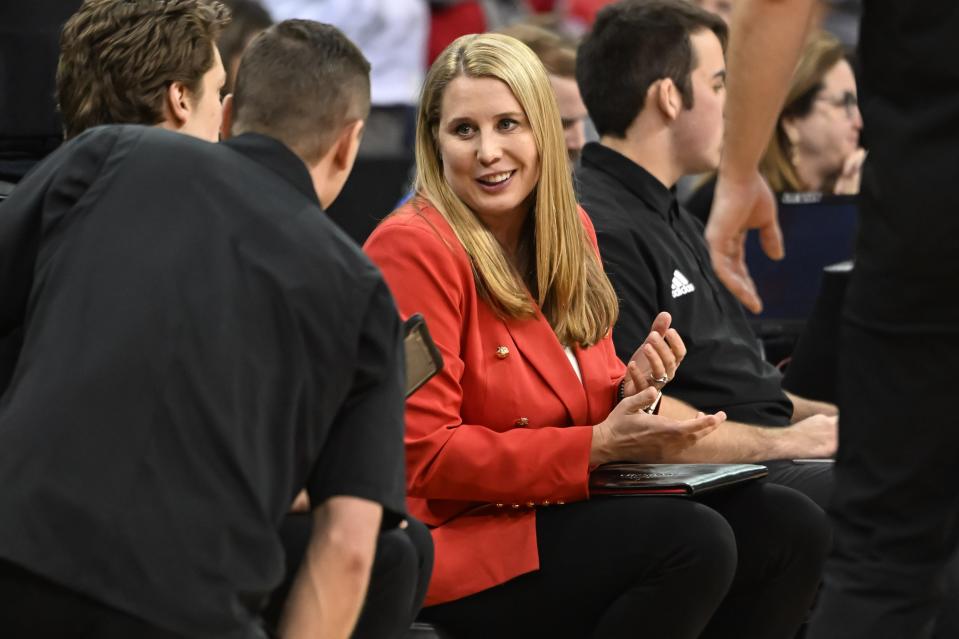 Dec 15, 2022; Omaha, Nebraska, US; Louisville Cardinals head coach Dani Busboom Kelly talks with her assistants during the match against the Pittsburgh Panthers in the semi-final match at CHI Health Center. Mandatory Credit: Steven Branscombe-USA TODAY Sports