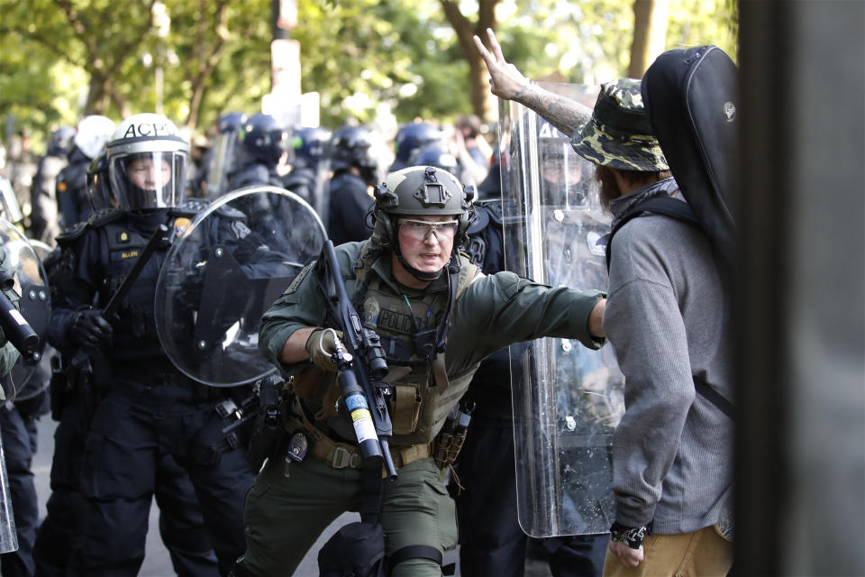 Police begin to clear demonstrators gather as they protest the death of George Floyd, Monday, June 1, 2020, near the White House in Washington. Floyd died after being restrained by Minneapolis police officers. (AP Photo/Alex Brandon)