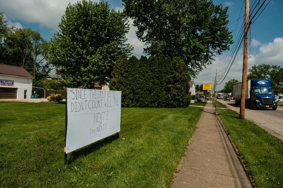 Hand made signs are seen along N. Wooster Ave., Thursday, May 19 in Strasburg.