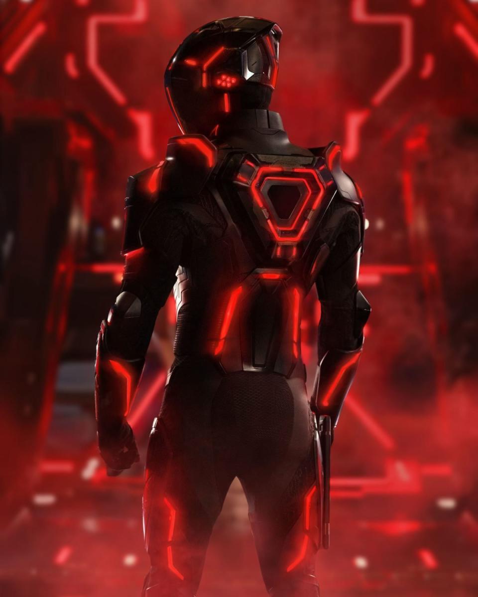 A figure in a red Tron light suit on a red, glowing background in the first look at Tron: Ares