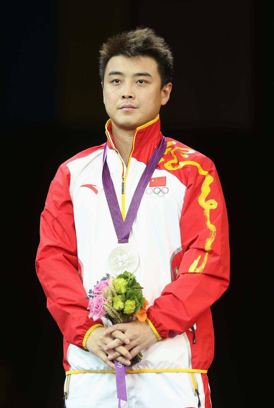 LONDON, ENGLAND - AUGUST 02: Silver medalist Wang Hao of China poses on the podium during the medal ceremony during the medal ceremony for the Men's Singles Table Tennis on Day 6 of the London 2012 Olympic Games at ExCeL on August 2, 2012 in London, England. (Photo by Feng Li/Getty Images)