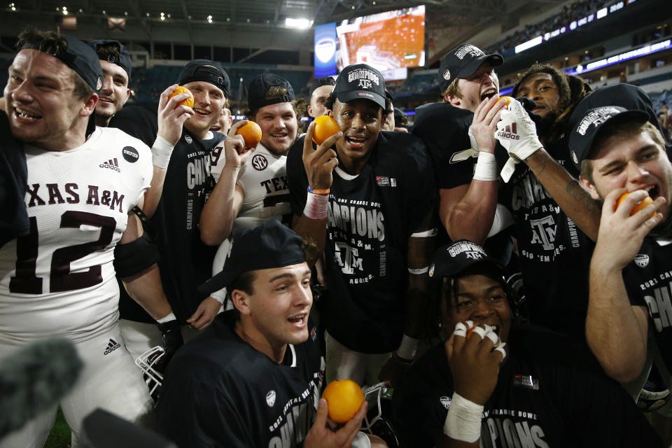 MIAMI GARDENS, FLORIDA - JANUARY 02: The Texas A&M Aggies celebrate after defeating the North Carolina Tar Heels 41-27 in the Capital One Orange Bowl at Hard Rock Stadium on January 02, 2021 in Miami Gardens, Florida. (Photo by Michael Reaves/Getty Images)