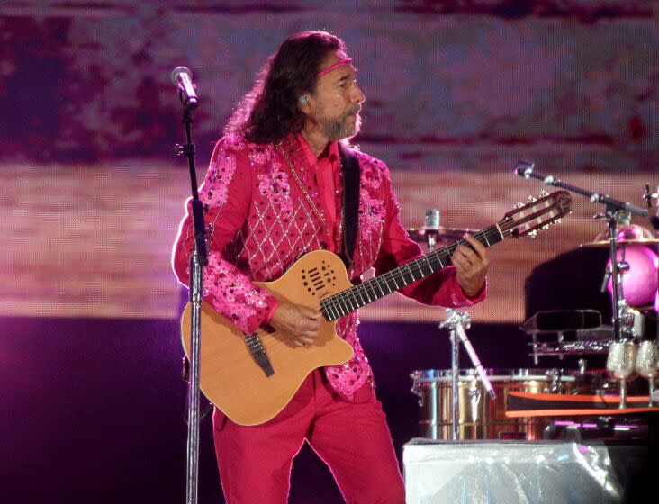 Los Bukis frontman and co-founder Marco Antonio Solis plays with the legendary Mexican grupera band for their Una Historia Cantada Tour at the Los Angeles Coliseum on Thursday, Aug. 18, 2022.