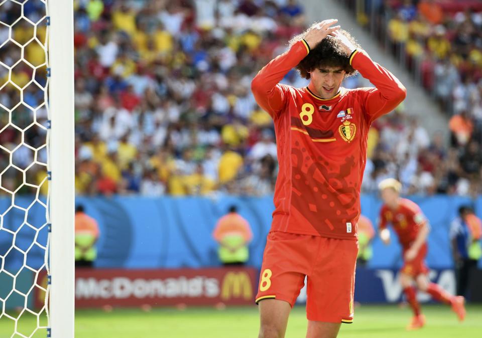 Belgium's Marouane Fellaini reacts after missing an opportunity to score a goal against Argentina during their 2014 World Cup quarter-finals at the Brasilia national stadium in Brasilia July 5, 2014. REUTERS/Dylan Martinez