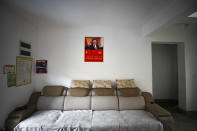 A poster showing an image of Chinese President Xi Jinping is seen displayed on a wall of a home of members of the Yi minority group in Xujiashan village in Ganluo County, southwest China's Sichuan province on Sept. 10, 2020. Communist Party Xi’s smiling visage looks down from the walls of virtually every home inhabited by members of the Yi minority group in a remote corner of China’s Sichuan province. Xi has replaced former leader Mao Zedong for pride of place in new brick and concrete homes built to replace crumbling traditional structures in Sichuan’s Liangshan Yi Autonomous Prefecture, which his home to about 2 million members of the group. (AP Photo/Andy Wong)