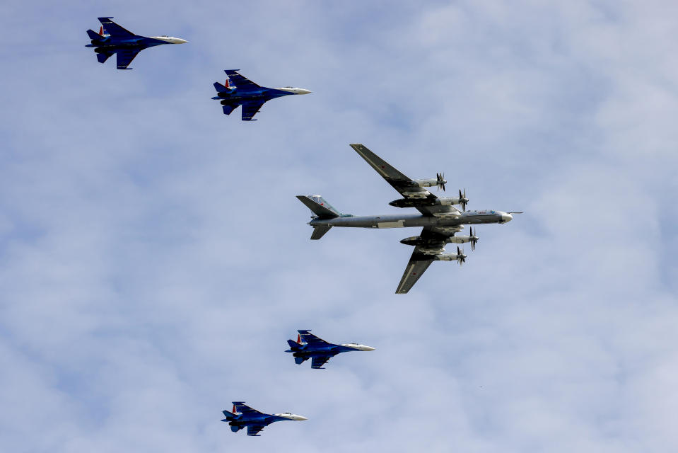 A Russian Tupolev Tu-95 strategic bomber flies over Moscow, accompanied by fighter jets, during a rehearsal for the Victory Day parade in Russia's capital, in a May 7, 2022 file photo. / Credit: Sefa Karacan/Anadolu Agency/Getty