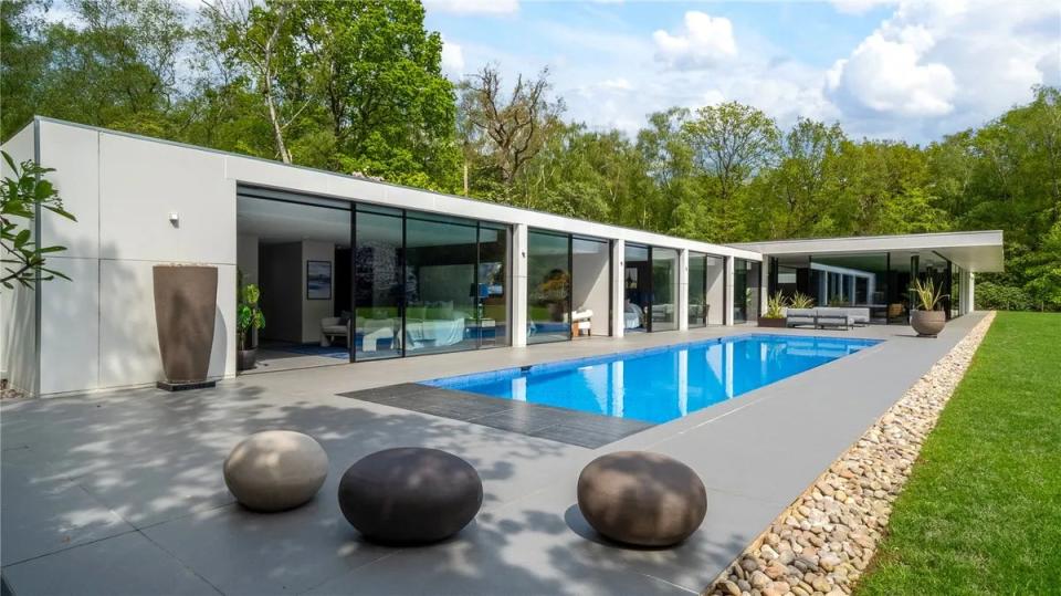 The house has a swimming pool set in five acres of gardens (Zoopla)