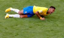 Brazil's Neymar lies on the pitch after sustaining an injury. REUTERS/David Gray