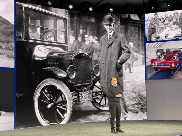 Ford CEO Jim Farley speaks to a packed room of industry analysts and media while standing in front of an image of company founder Henry Ford at the Ford Experience Center for Capital Markets Day in Dearborn on May 22, 2023.