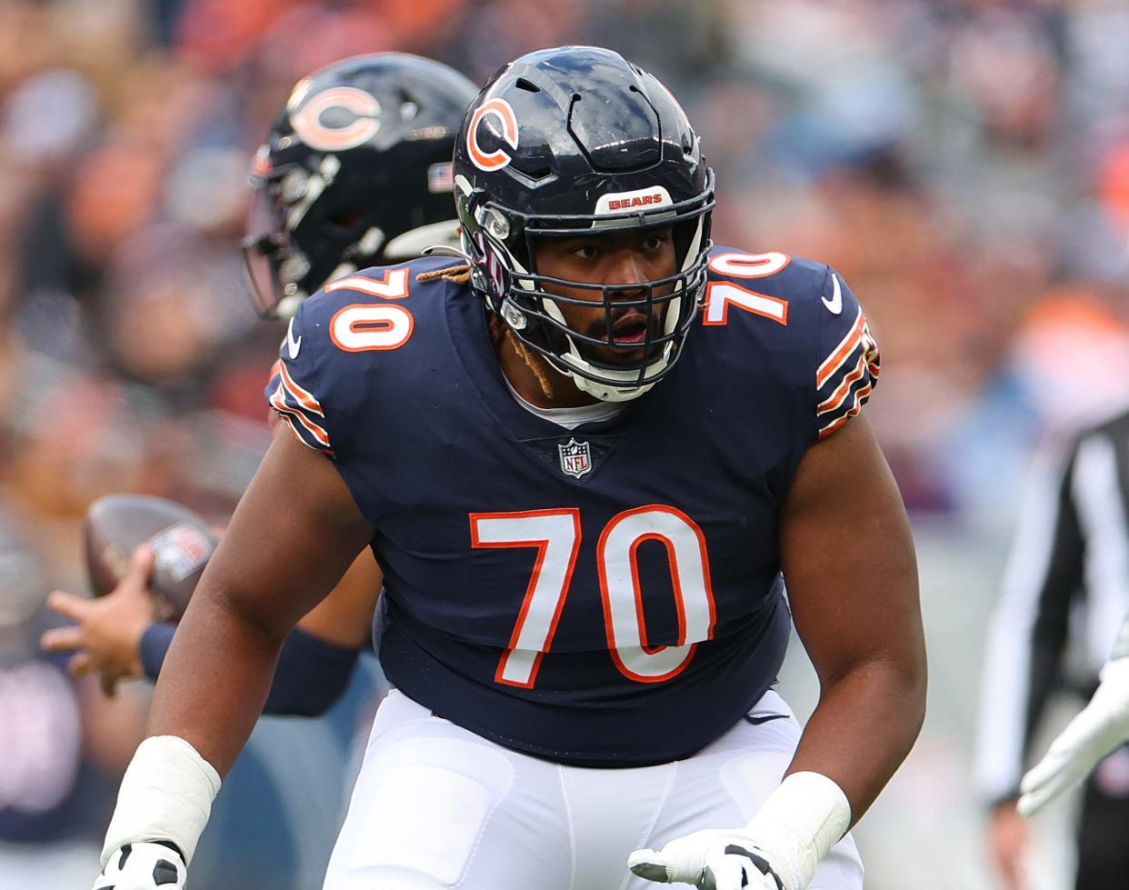 Chicago Bears offensive lineman Braxton Jones looks to block against the Detroit Lions.