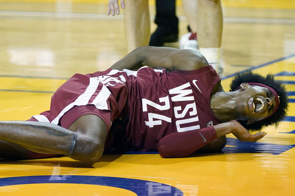 Washington State guard Noah Williams (24) reacts after falling to the floor while shooting against Stanford during the first half of an NCAA college basketball game in Santa Cruz, Calif., Saturday, Jan. 9, 2021. (AP Photo/Jeff Chiu)