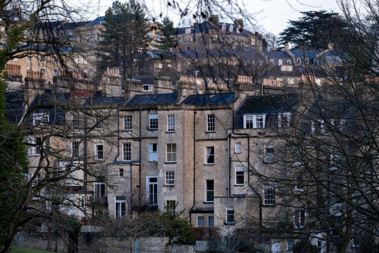 UK house prices fall for fourth consecutive month. Photo: PA/Alamy Rooftops and chimneys of Georgian buildings on 29th December 2022 in Bath, United Kingdom. Bath is a city in the county of Somerset, known for and named after its Roman-built baths, and Georgian architecture made from the local honey coloured Bath Stone. The city became a World Heritage Site in 1987, and was later added to the transnational World Heritage Site known as the ‘Great Spa Towns of Europe’ in 2021.