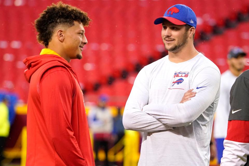 Kansas City Chiefs quarterback Patrick Mahomes, left, talks with Buffalo Bills quarterback Josh Allen before the start of an NFL football game between the Kansas City Chiefs and the Buffalo Bills