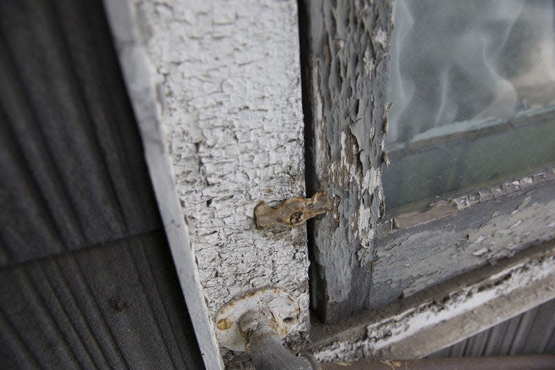 A new Indiana state law taking effect in July will require health care providers to test children under 6 for lead. In this South Bend Tribune file photo, Chipped lead paint surrounds a window on a South Bend home.