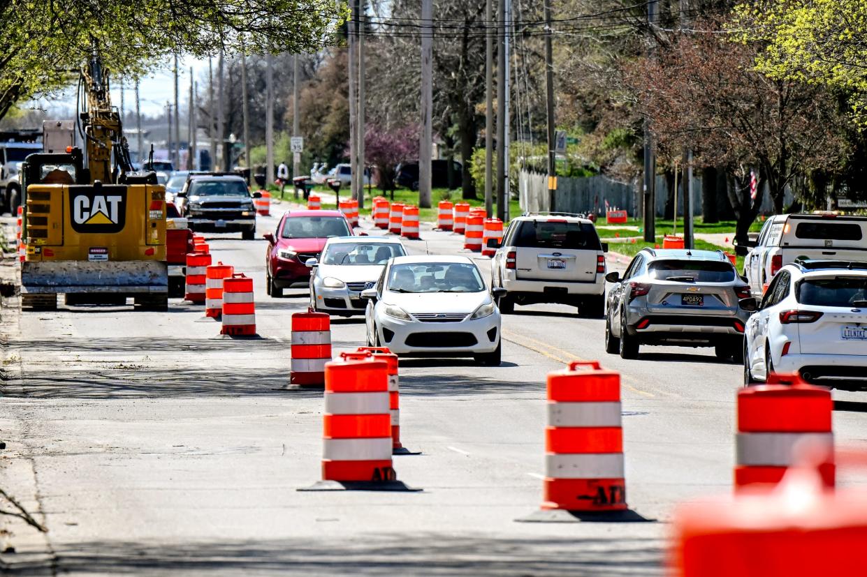 Traffic moves along on Coolidge Road in April in East Lansing. Ongoing work will close the road completely this week.